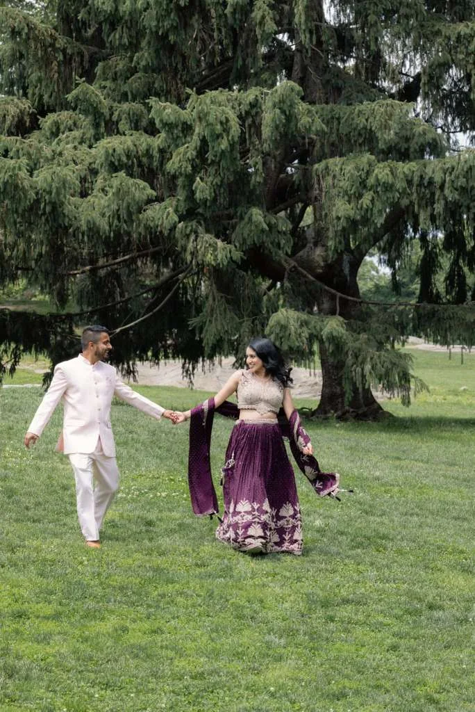 Justin and Angel walking across a lawn